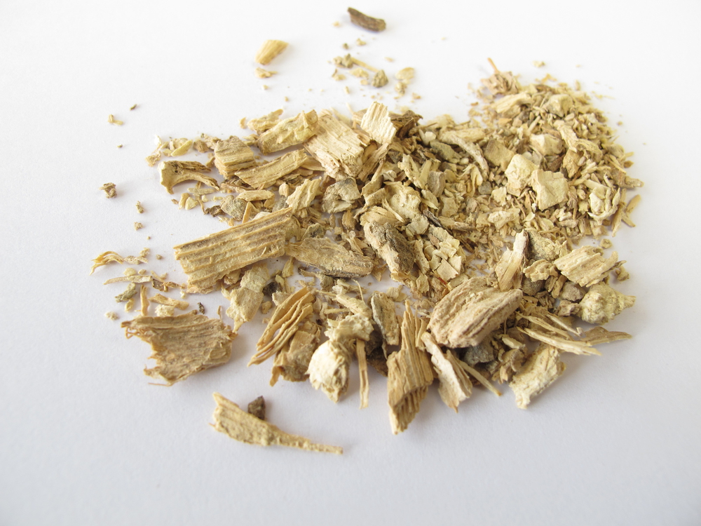 Linkable kava guides Dried and shredded kava root pieces scattered on a white surface